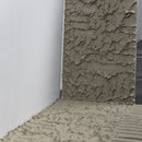 Mapei Keraflex Plus mortar being applied with a notched trowel